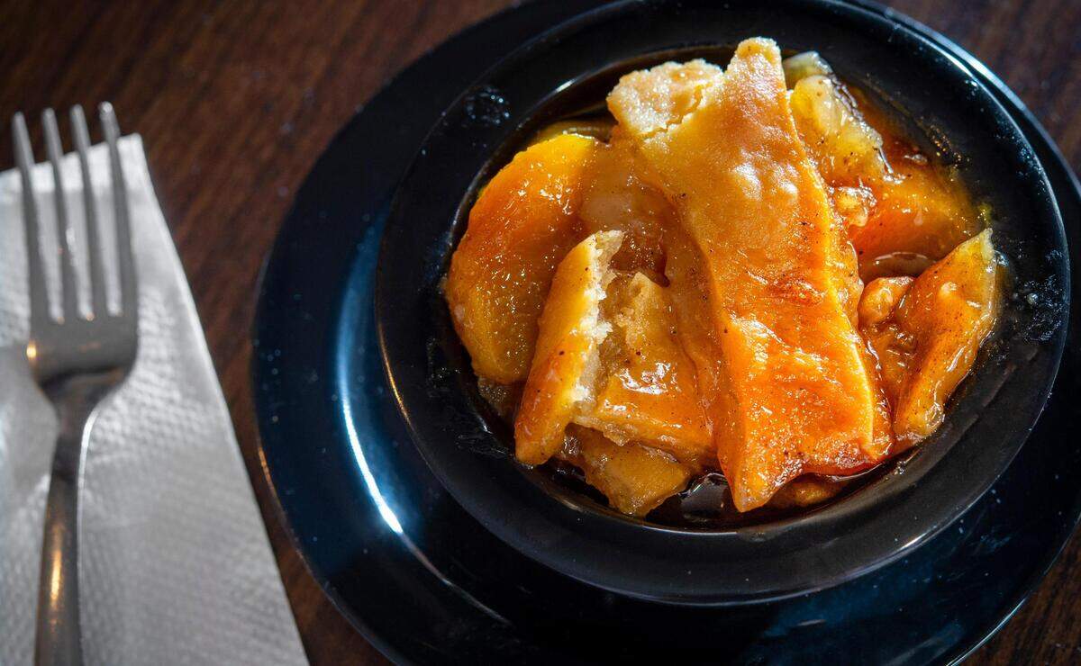 Peach cobbler is one of the most popular dishes at PeachTree in Kansas City.
